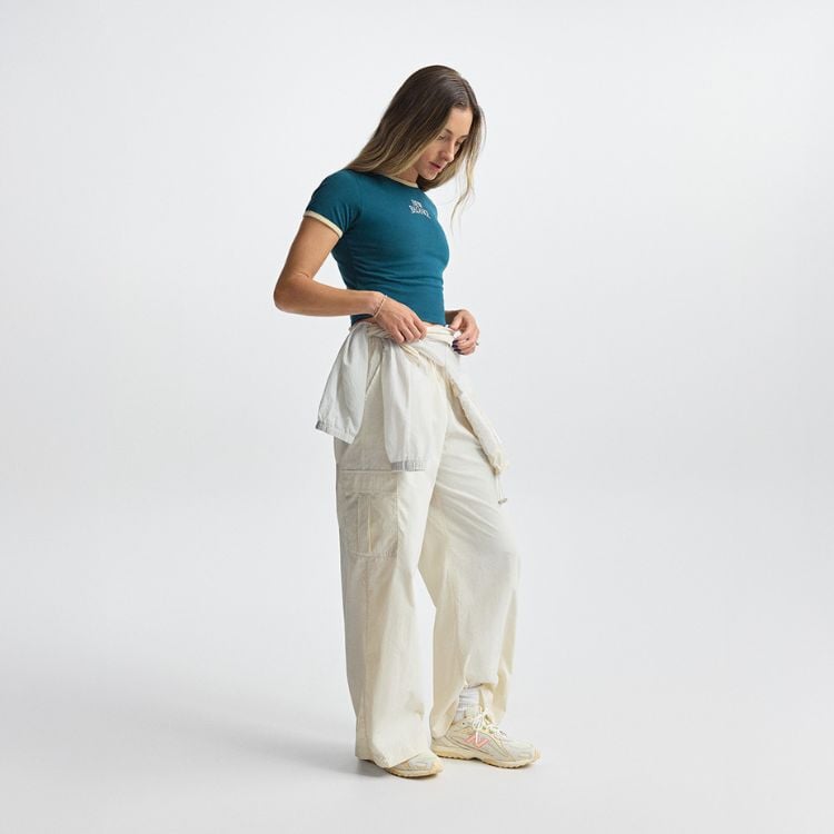 Person a chair wearing new balance exclusive footwear